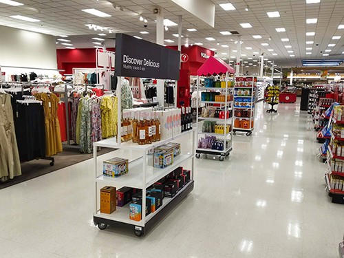 Wheeled cart display in floor aisle.